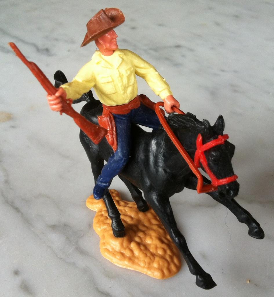 cow-boy à cheval fusil